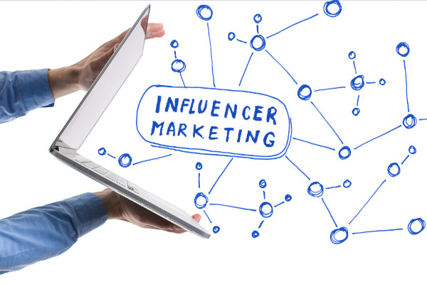 influencer marketing image depicting interconnected dots emerging from a laptop